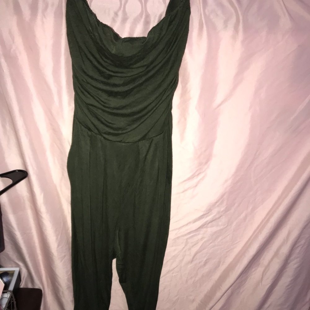 Size small green jump suit .